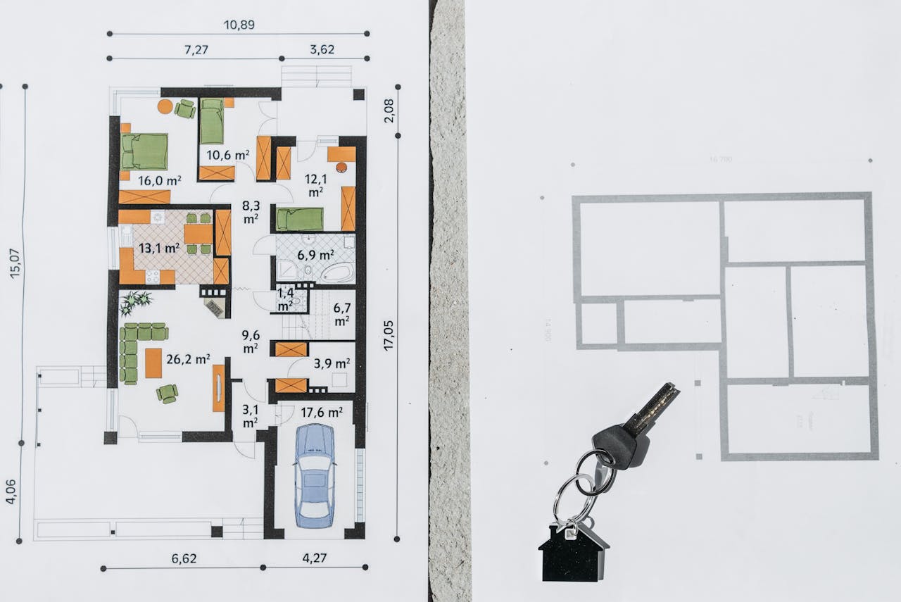 A comprehensive floor plan layout featuring a house key symbolizing real estate and homeownership.